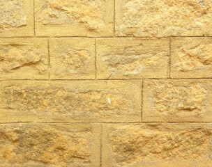 Beige color concrete brick blocks wall background