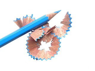 Blue color pencil with shavings on white background