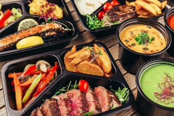 group of food in plastic dish on table. take away food
