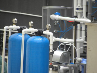 Blue color cylinders of water treatment and filtration system