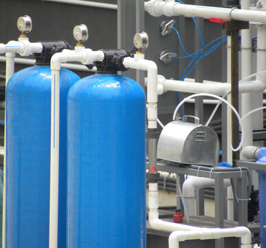 Blue color cylinders of water treatment and filtration system
