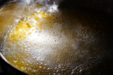 boiling corn porridge in a pot 