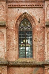 Fototapeta na wymiar Vintage window. Old red brick church 