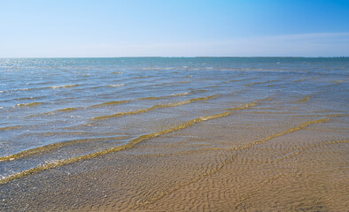 Fototapeta na wymiar sea bay with sandy cape, brigh summer seascape