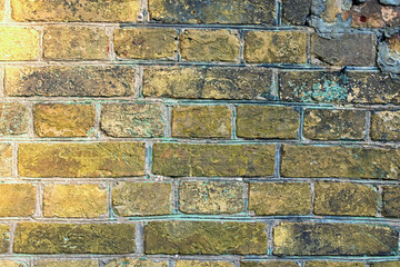 Old brick wall with interesting structure. Ancient brick wall. Ancient stone interior. Stone block seamless background. Outdoor and indoor interiors. Close-up view of cement bonded brick wall