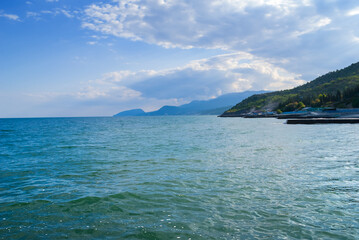 Obraz premium emerald sea bay under a cloudy sky, Crimea, Ukraine