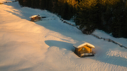 Tschey valley, beautiful landscape with snowy wooden old houses and haystacks