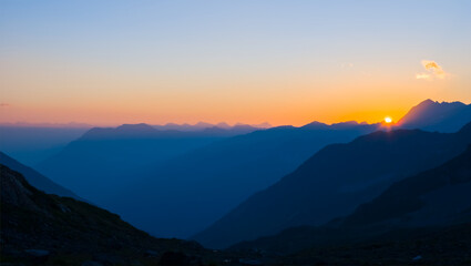mountain chain silhouette at the sunset, twilight mountain landscape