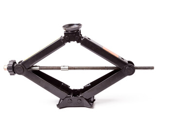 Black metal jack on white background in a car service. A lifting device that locks the car at a predetermined height for mounting, diagnosing and repairing the suspension without a lift tool for sale.