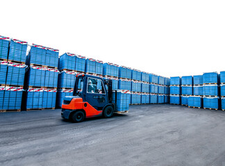 Auto loader with concrete blocks near house-building factory