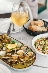 Portuguese clams "a bulhao pato" style served with the white wine. 