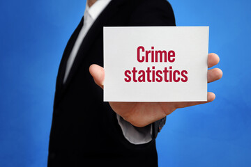 Crime statistics. Lawyer holding a card in his hand. Text on the board presents term. Blue background. Law, justice, judgement