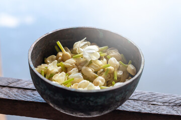 Jasmine in brass bowl