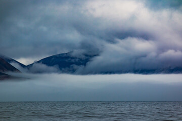 Fog in the mountains near the sea in Chukotka