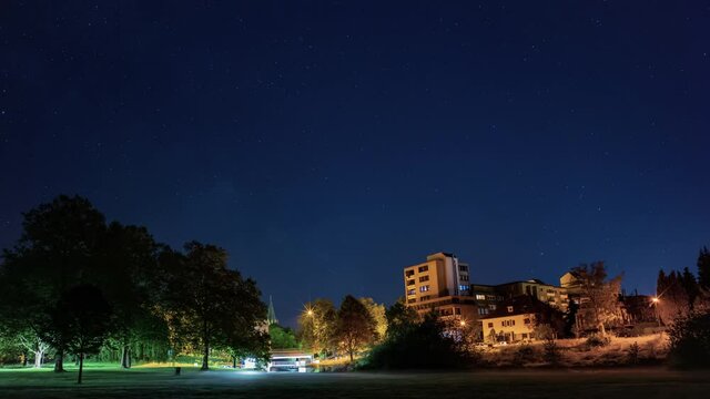 Time lapse of a starry night sky over a city. Paderborn night.