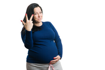 Pregnant woman showing three fingers as counting concept
