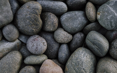 Fototapeta na wymiar Grey pebbles stone background with vintage filter 
