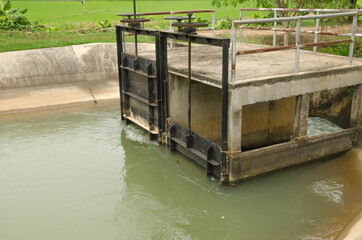 Black floodgate with controller in canal
