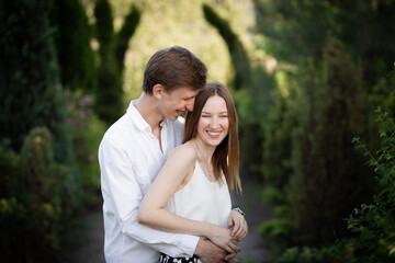 The young couple walking in the park