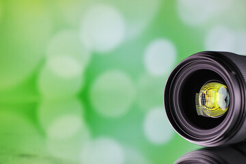 Equipment videographer and photographer. Lenses on the table against the background of bright...