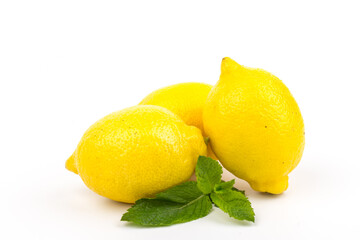 Group of lemons with mint leaves, isolated on white background