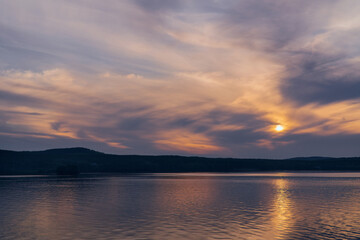 Fototapeta premium beautiful clouds during sunset over the lake