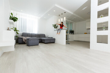 A living room filled with furniture and a large window