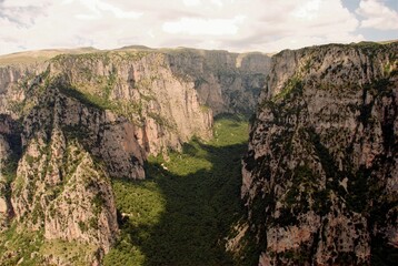 Panoramic view of the Vikos gorge from the viewpoint Oxya of Monodendri village, one of the 45 villages known as Zagoria or Zagorochoria in Epirus region of southwestern Greece.