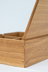 Large wooden box with a separator on a light mint background empty. Product Display Concept. Copy...