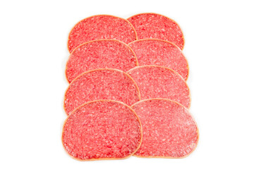 Salami slices isolated on white background.