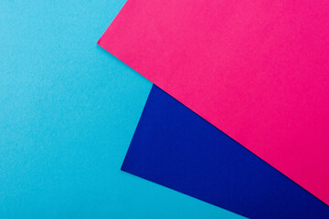 abstract geometric background with pink, blue paper