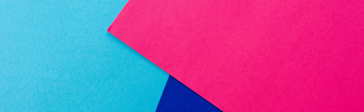 abstract geometric background with pink, blue paper, panoramic shot