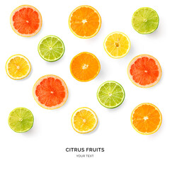 Obraz premium Creative pattern made of lemon, lime, orange and grapefruit. Flat lay. Food concept. Lemon, lime, orange and grapefruit on white background.