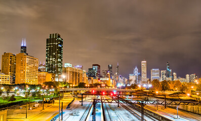 Fototapeta na wymiar Night view of Chicago above a railway at Grant Park in Illinois, United States