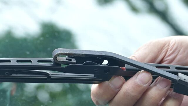 Installing vehicle windshield wiper close up
