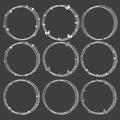 Set of white circle frames with dark background .
