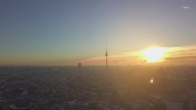 AERIAL: Over Berlin Center with view on Alex in beautiful Morning light in Winter