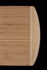Wooden cutting board on a black background