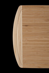 Wooden cutting board on a black background