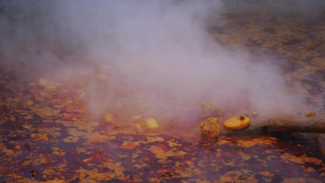 Bograch. Soup with paprika, meat, bean, vegetable, dumpling. Traditional Hungarian Goulash in cauldron. Meal cooked outdoors on an open fire. HD