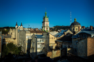 Fototapeta na wymiar panoramic view on historical center with high tower and catholic cathedral in Lviv city