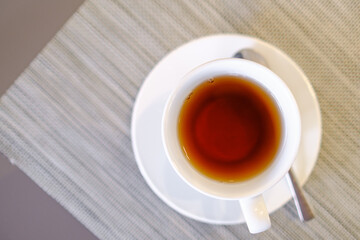 tea in white grass on the table