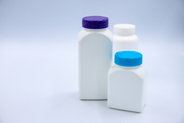 Plastic bottle set for pills or vitamins on white background. Round and square pharmacologic container mockup. Pill or drug jar blank package design. Clean pack for medicine diet vitamin