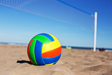 Obraz premium Beach Volleyball. Game ball on sand waiting for game. At the beach.