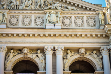 closeup facade of Lviv opera and ballet theatre with different marble sculptures