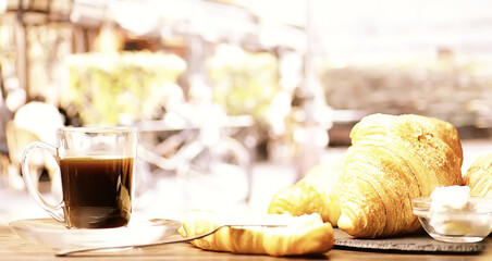 Fresh pastries on the table. French flavored croissant and coffee.