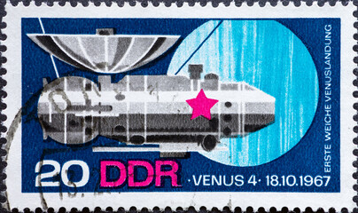 GERMANY, DDR - CIRCA 1968: a postage stamp from Germany, GDR showing a spaceship of the USSR Venus 4. Text: First soft landing of the Venus © zabanski