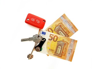 Paper money euro on a white background with keys. Wealth.