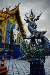 Fototapeta na wymiar Wat Rong Suea Ten or The Blue Temple translates as House of the dancing tiger. A monumental, modern Buddhist temple distinguished by its vivid blue coloring & elaborate carvings in Chiang Rai Province