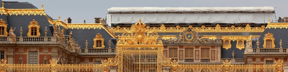 Panoramic view of the golden gates of the Palace of Versailles, France